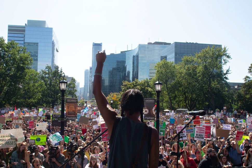 First Nations activist Caroline Crawley addresses the crowd as protesters gather outside the Ontario legislature for a climate strike in Toronto on Sept. 27, 2019.
