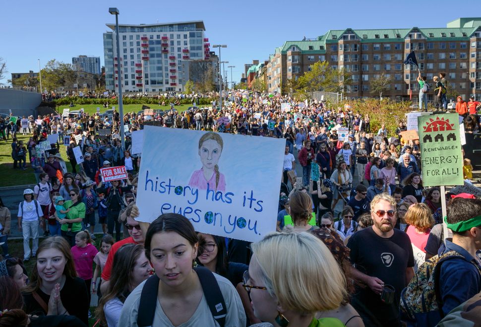 A drawing of Greta Thunberg is seen on a protest sign as thousands march on the property of Nova Scotia Power during a climate strike in Halifax on Sept. 27, 2019.