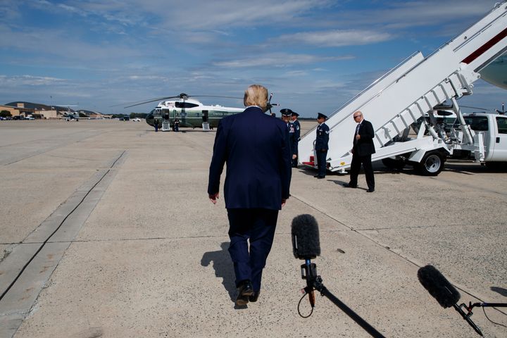 Trump walks off after speaking with reporters after arriving at Andrews Air Force Base on September 26, 2019.
