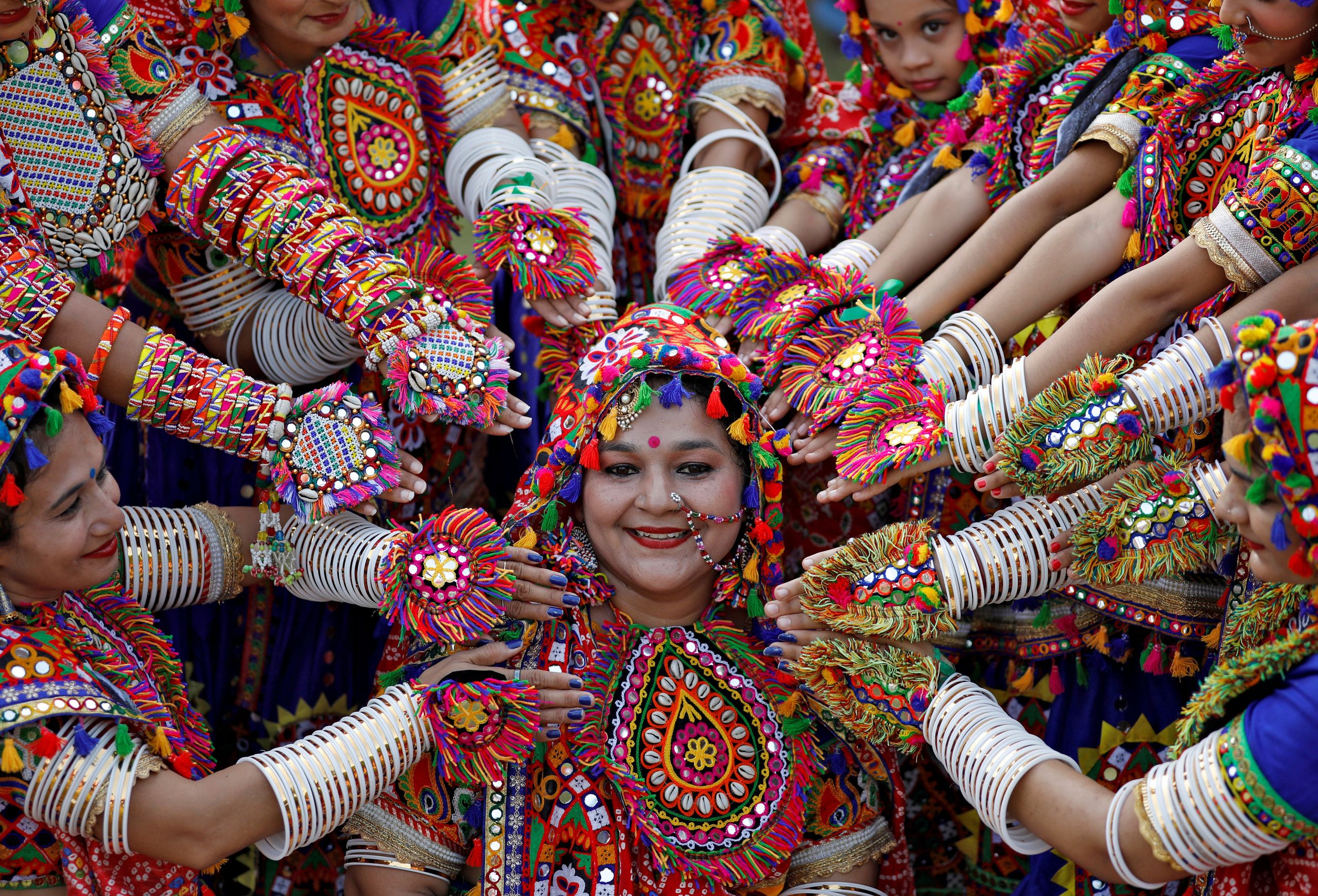 Participants dressed in traditional attire pose at rehearsals for Garba, a folk dance, in preparations for the Navratri, a fe