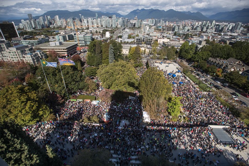 Thousands of people gather outside Vancouver City Hall before marching downtown for a climate strike in Vancouver on Sept. 27, 2019. 