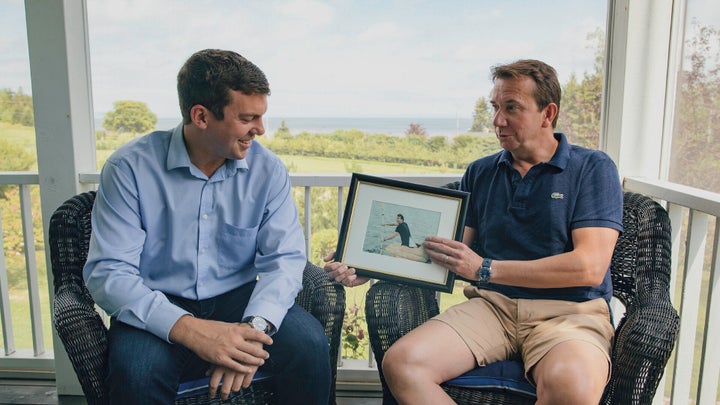 Liberal candidate Kody Blois and Scott Brison chat at the former Liberal cabinet minister's Cheverie, N.S. home talk about a local pumpkin paddling tradition and to impart advice on keeping a level head in federal politics.