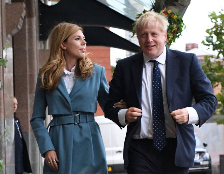 Prime Minister Boris Johnson arrives at the Conservative Party conference in Manchester accompanied by partner Carrie Symonds.