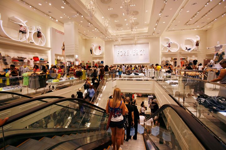 Customers shop at the Forever 21 flagship store in New York's Times Square on June 25, 2010. 