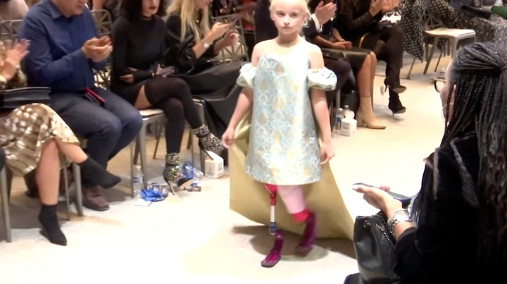 Model Daisy-May Demetre, a nine-year-old double amputee, walked the runway during Paris Fashion Week for luxury children's wear label Lulu et Gigi.