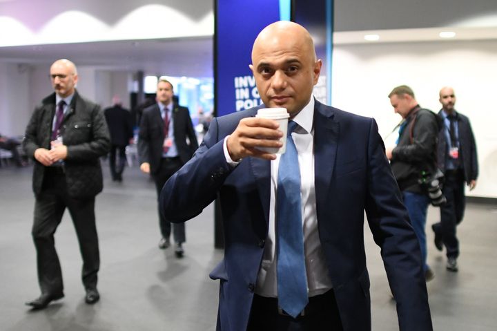 Chancellor Sajid Javid sips a drink ahead of the first session of the day at the Conservative Party Conference at the Manchester Convention Centre.