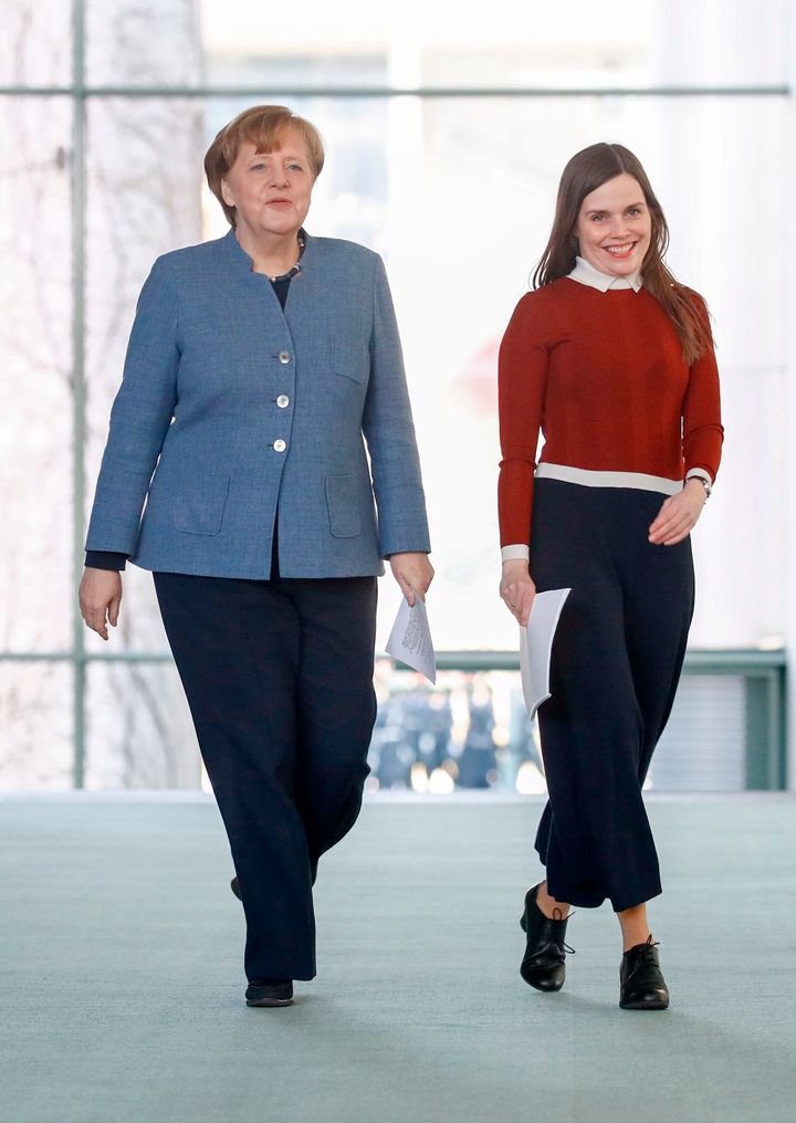 Iceland Prime Minister Katrin Jakobsdottir (right) prepares to talk to journalists with German Chancellor Angela Merkel on March 19, 2018, in Berlin.