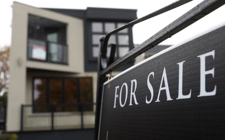 A for-sale sign in front of a home in the Toronto borough of East York.