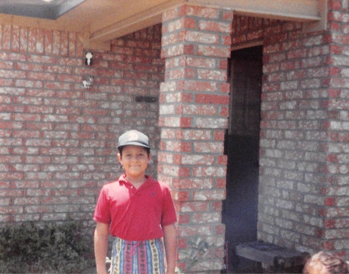 Standing outside the duplex we moved into after the bank foreclosed on our old house. I'd just figured out how to wash my own clothes in the bathroom sink. 