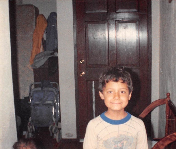 Me smiling awkwardly near our front door. The dining room was one of the first areas of our home to fill with junk and debris.