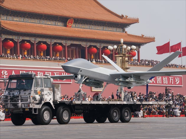 China's self-made weapons, vehicles and planes are shown during the military parade of the celebration...