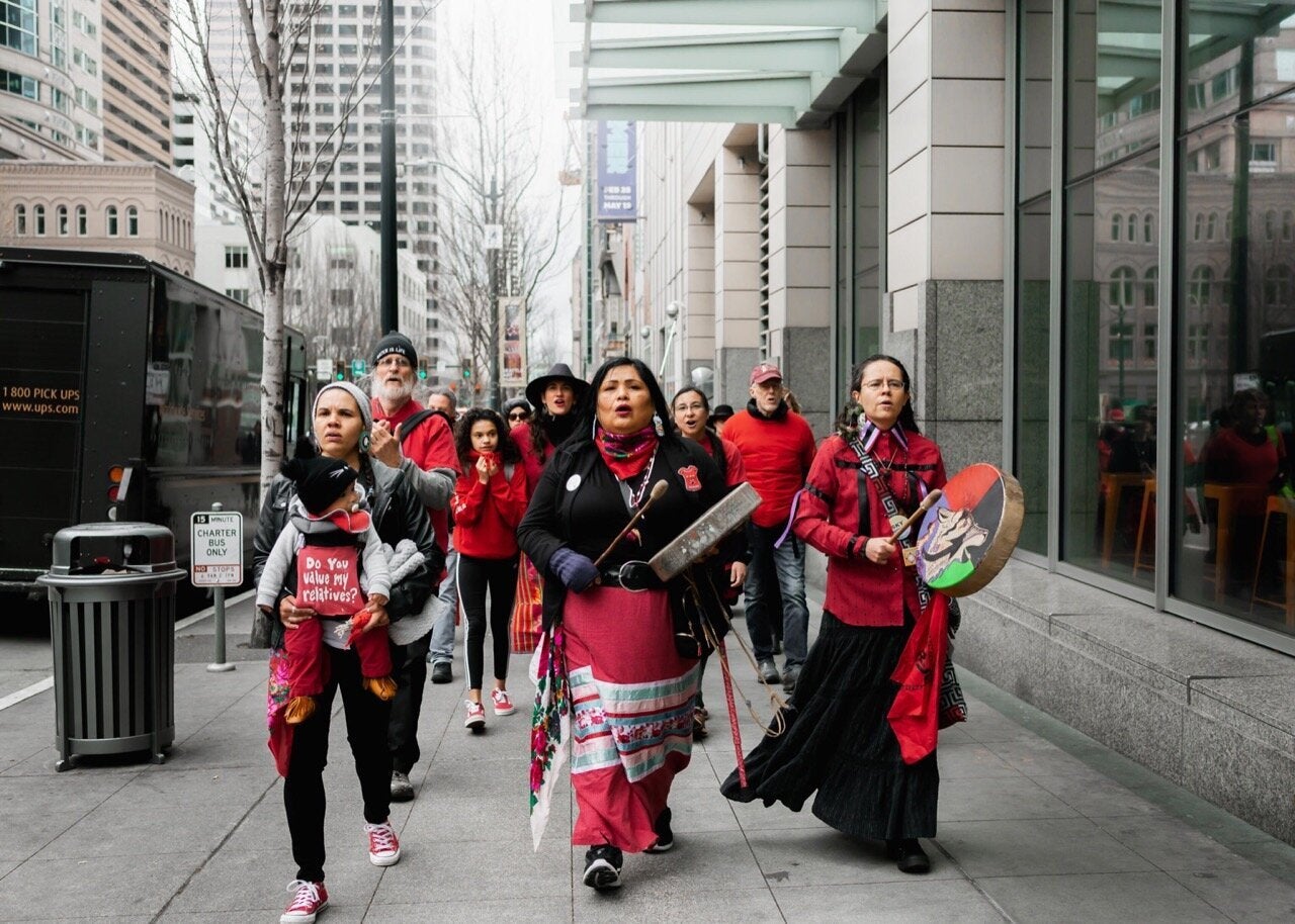 Rachel Heaton (front left) campaigning against Chase Bank in April 2019 for its funding of fossil fuel projects and the impacts on indigenous communities.