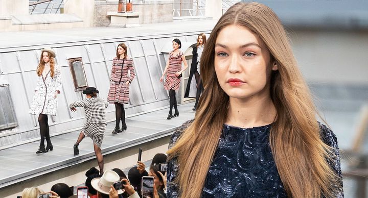 Gigi Hadid looked unimpressed as she removed a catwalk crasher at the Chanel Show. [Photo: Getty/AP]