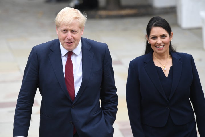 Prime Minister Boris Jonhson walks with Home Secretary Priti Patel at the Conservative Party Conference at the Manchester Convention Centre.