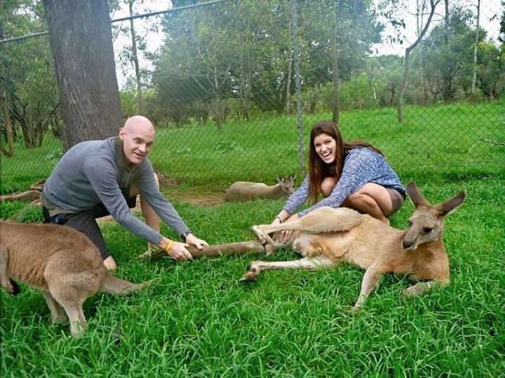 Varnish (right) and her brother Daniel reenacting their 1986 photo while revisiting Brisbane's Lone Pine Sanctuary, Australia, in February 2012.