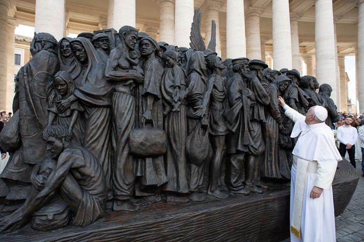 Pope Francis attends the unveiling Sunday of the sculpture commemorating migrants and refugees by Canadian artist Timothy Schmaltz in St Peter's Square in Vatican City.