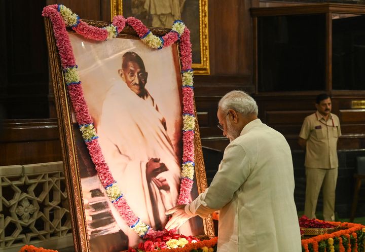 Prime Minister Narendra Modi pays tribute to Mahatma Gandhi at Parliament House in New Delhi on Wednesday.