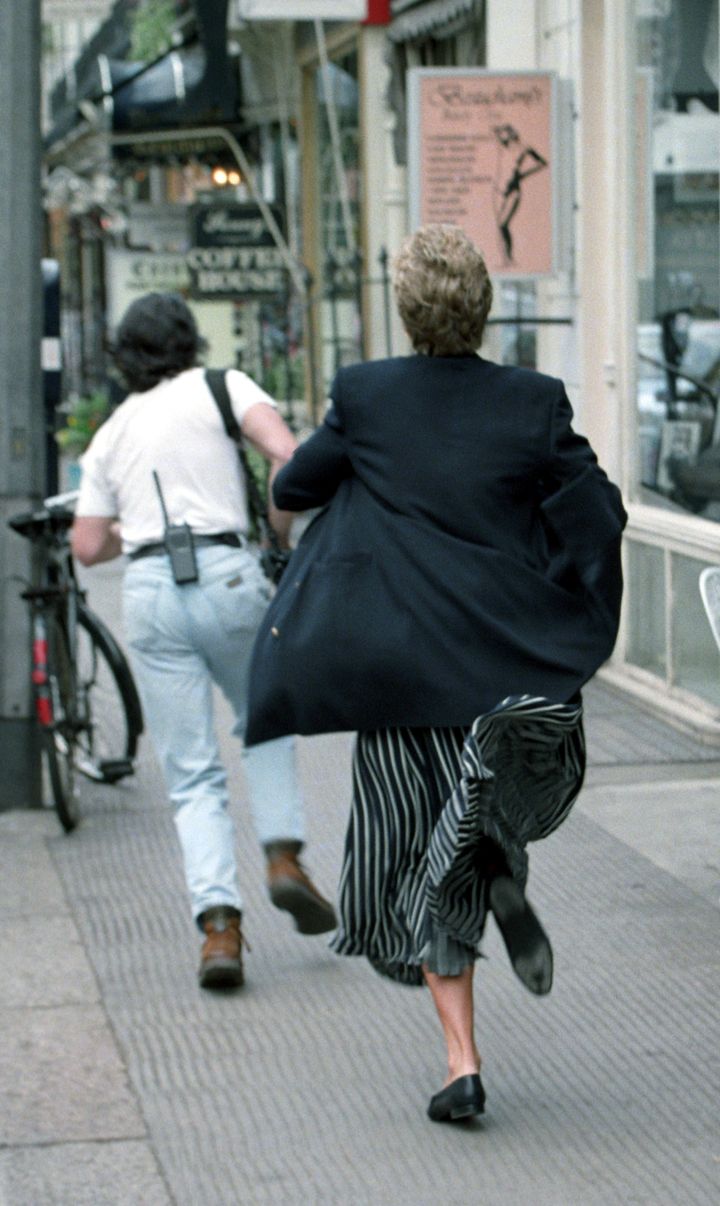 Princess Diana appearing to run after a member of the paparazzi who was bothering her 