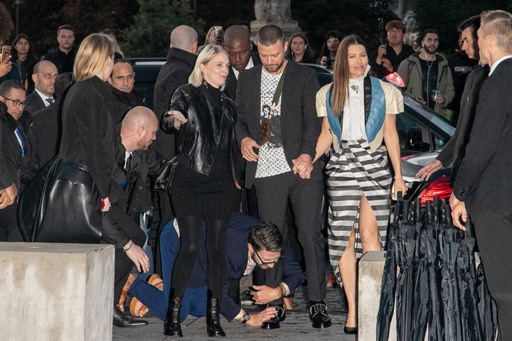 Vitalii Sediuk jumps on singer Justin Timberlake as he arrives to attend the Louis Vuitton Womenswear Spring/Summer 2020 show as part of Paris Fashion Week.
