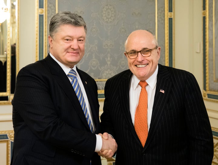 Ukraine's then-President Petro Poroshenko, left, poses with Rudy Giuliani during their meeting in Kiev, Ukraine, Wednesday, N