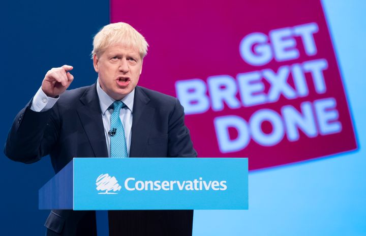 Prime Minister Boris Johnson on stage giving his speech at the Conservative Party Conference 