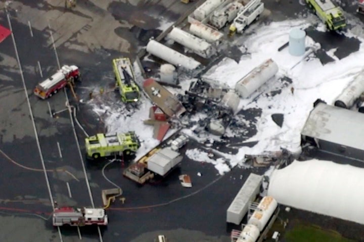In this aerial image taken from video, emergency crews respond to where a World War II-era bomber B-17 plane crashed at Bradl