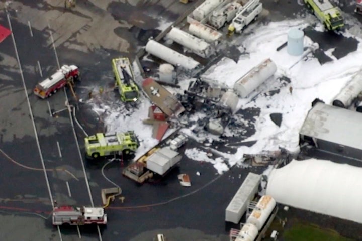 In this aerial image taken from video, emergency crews respond to where a World War II-era bomber B-17 plane crashed at Bradley International Airport in Windsor Locks, Connecticut on Wednesday.