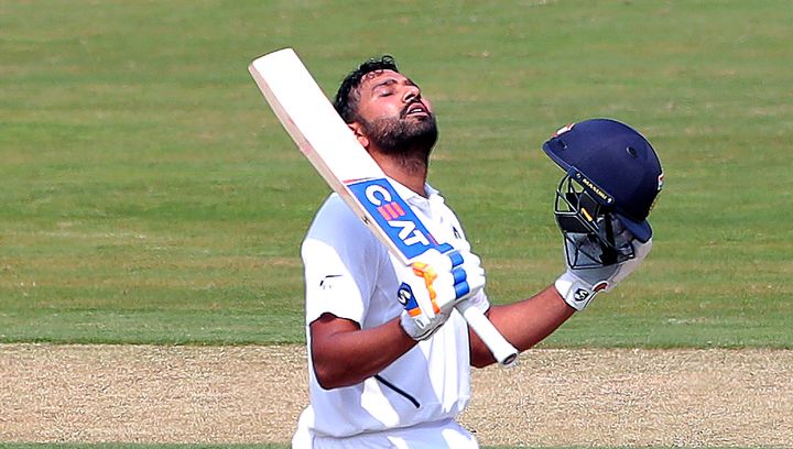 Rohit Sharma after scoring a hundred runs during the first day of the first cricket test match against South Africa in Visakhapatnam.