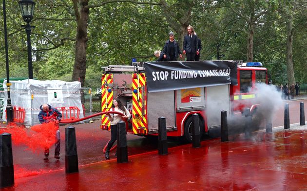 Extinction Rebellion Protest Sees Activists Spray 1,800 Litres Of Fake Blood At The Treasury Using A Fire Engine