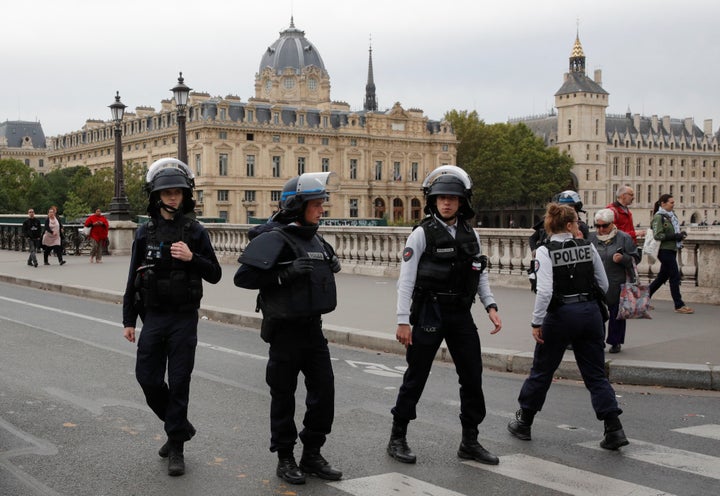 French police secure the area in front of the Paris Police headquarters in Paris.