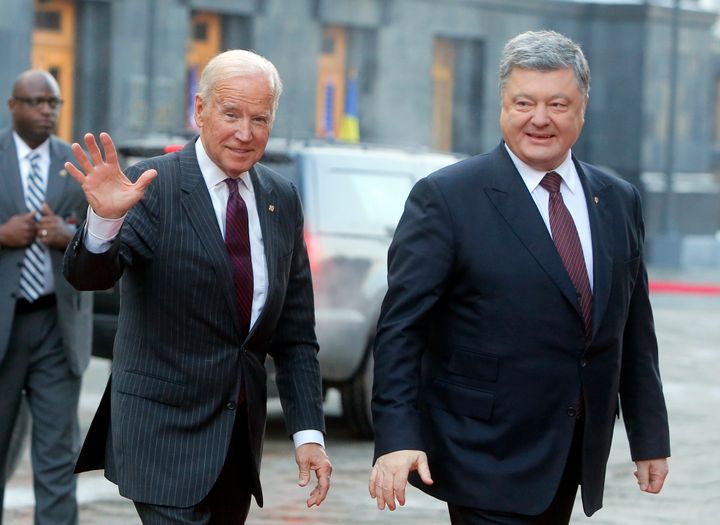 Then-Vice President Joe Biden, left, and Ukraine's then-President Petro Poroshenko smile at the media during a meeting in Kiev, Ukraine, in January 2017.
