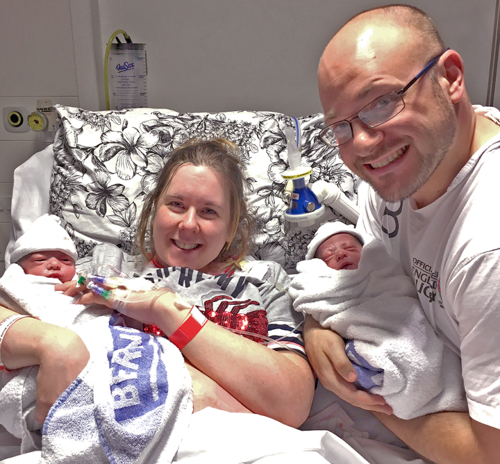 Nikki and Dan with their babies in hospital.