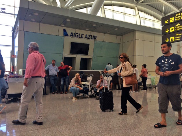 Strained passengers wait at the counter of French airline Aigle Azur on September 6, 2019 at Algiers'...