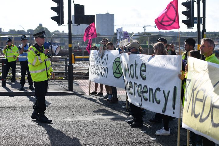 Police officers with Extinction Rebellion protesters in Birmingham 