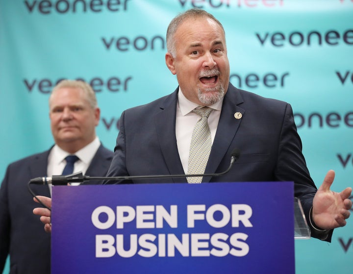 Ontario Minister Todd Smith speaks with Premier Doug Ford at an event in Markham, Ont.