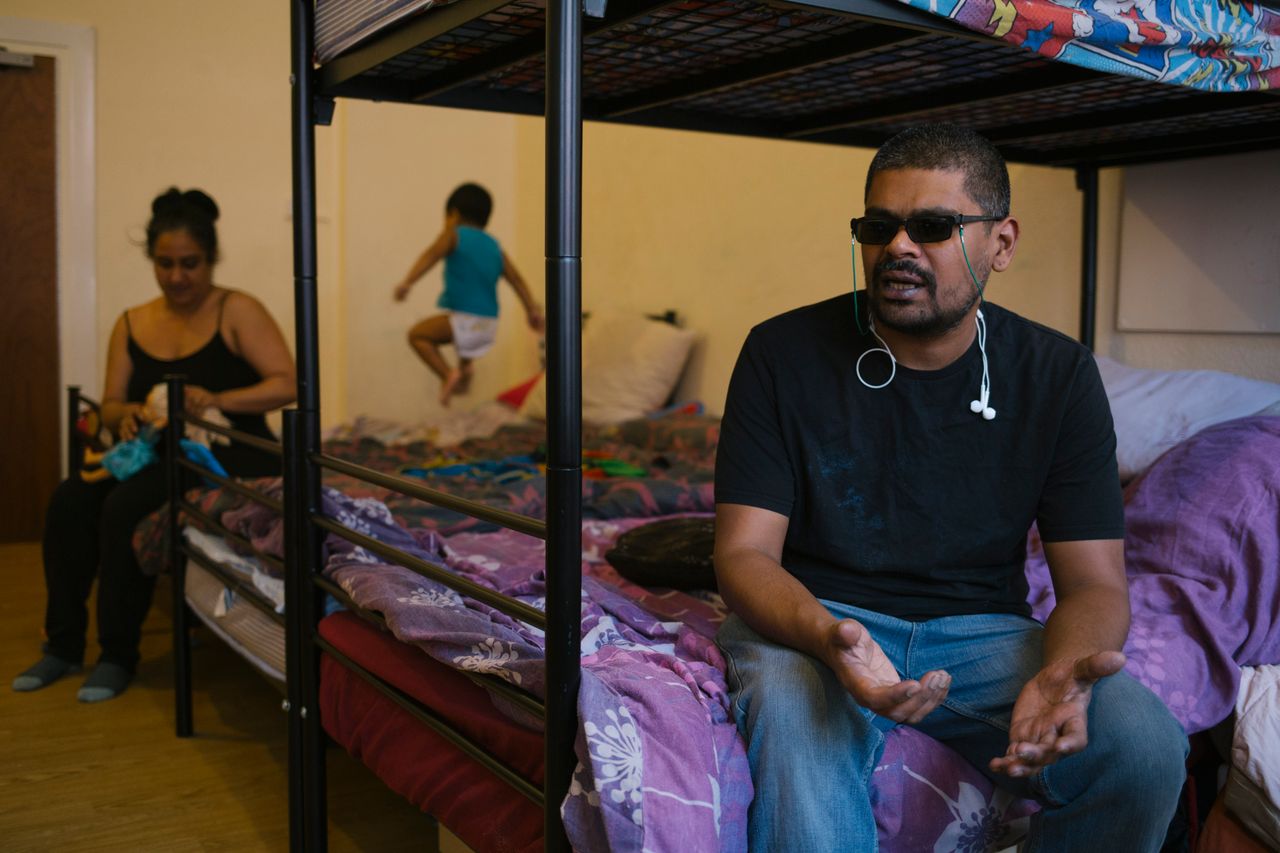 Mohammad and his family - and his guide dog - share a one-bed unit in a homeless hostel
