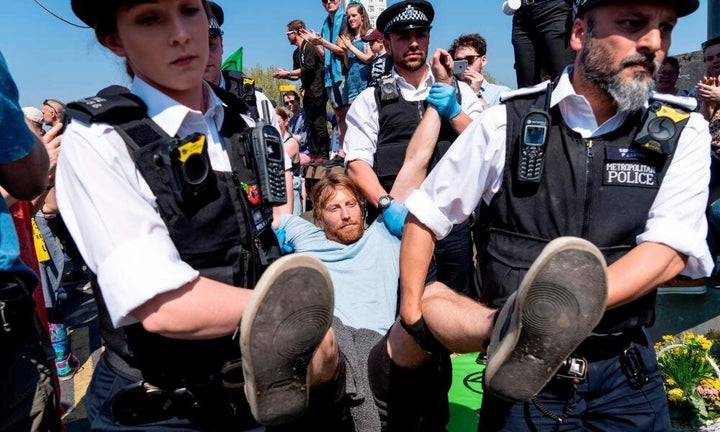 Police make an arrest while clearing Waterloo Bridge of protesters earlier this year. 