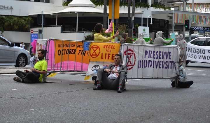 Brisbane's second major protest saw a major road blocked in peak hour. Activists locked themselves onto fencing with a combination of bike locks and super glue. 