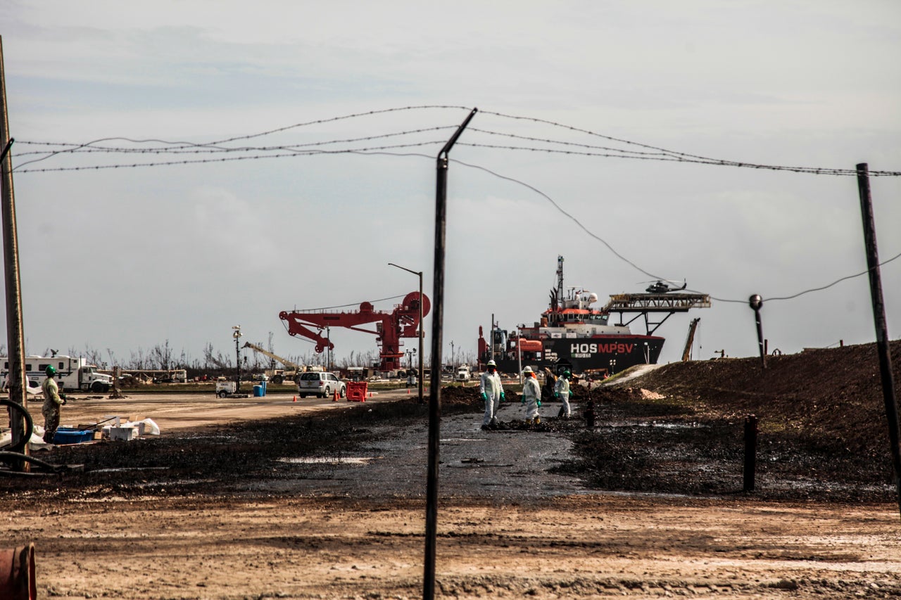 Workers are cleaning up what they can in Freeport, Grand Bahama.