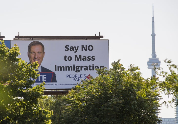 A Toronto billboard sign promoting the People's Party of Canada, which has promised to reduce the country's immigration numbers if elected. The sign were not funded by the party.