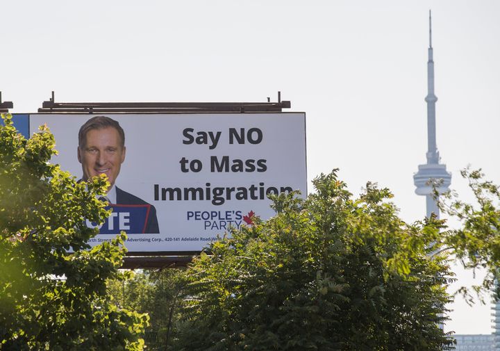 A Toronto billboard sign promoting the People's Party of Canada, which has promised to reduce the country's immigration numbers if elected. The sign were not funded by the party.
