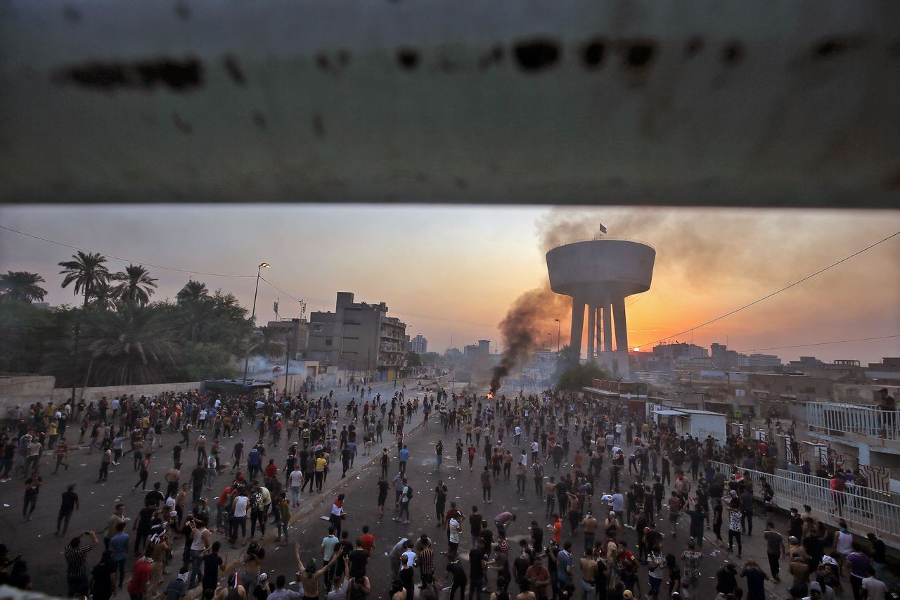 Iraqi protesters gather at Tayaran square in Baghdad on October 2.