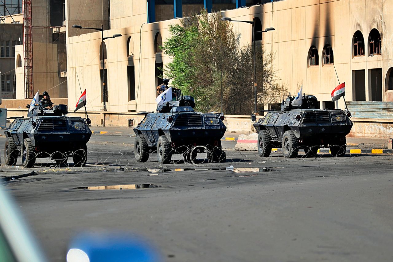 Iraqi security forces close a bridge road near the site of the protests in Tahrir square, central Baghdad, Iraq, Saturday, Oct. 5, 2019. Curfew has been lifted Saturday in the Iraqi capital, days after authorities imposed it in an attempt to quell anti-government demonstrations that have turned deadly. Officials say at least 64 were killed in the four-day protests that have rocked the capital and southern cities. (AP Photo/Hadi Mizban)