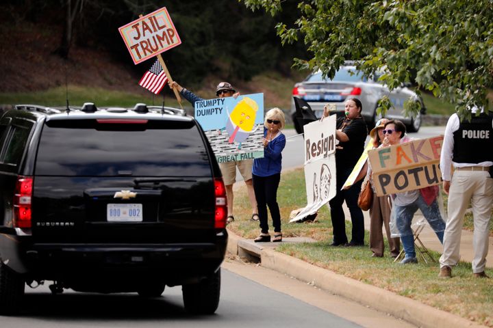 U.S. President Donald Trump's motorcade passes by protestors outside Trump National Golf Club in Sterling, Virginia on October 5, 2019. (Photo by Yuri Gripas/Sipa USA)