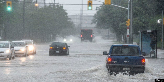 TORONTO, ON - JULY 8: TORONTO, ON - Flooding along the East Mall near Dundas Street West, Monday JULY 8, 2013. July 8, 2013. Tara Walton/Toronto Star (Tara Walton/Toronto Star via Getty Images)