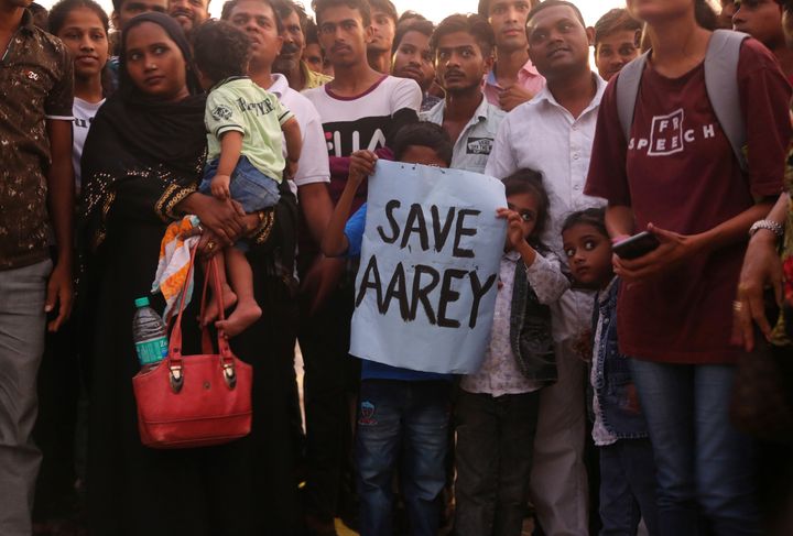 Children hold a placard during a protest against cutting down of trees for a proposed metro car shed project at Aarey Colony in Mumbai, Oct. 6, 2019. 