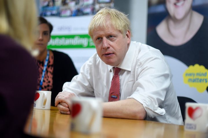 Johnson speaks to mental health professionals during his visit to Watford General Hospital