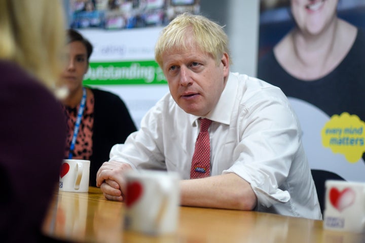 Johnson speaks to mental health professionals during his visit to Watford General Hospital