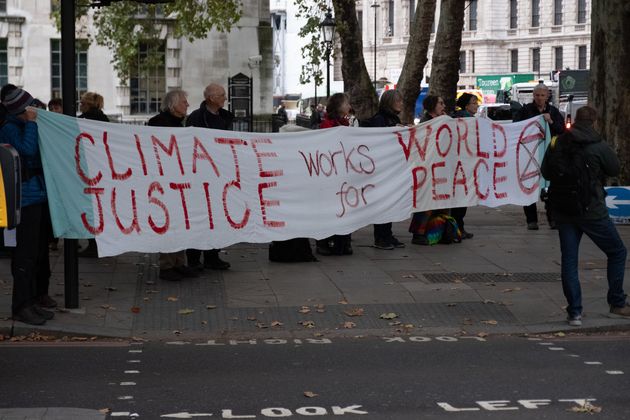 Extinction Rebellion Protesters with Climate Justice banner on the Embankment in London, England on October 7, 2019.(Photo by Robin Pope/ SIPA USA)