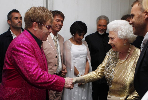 Queen Elizabeth II speaking with Sir Elton John backstage after the Diamond Jubilee concert at Buckingham Palace on June 4, 2012 in London, England.